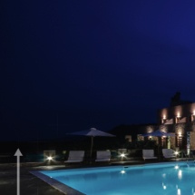 empty and illuminated outdoor swimming pool of greek luxury hotel in pyrgiotika nafplio during summer vacation